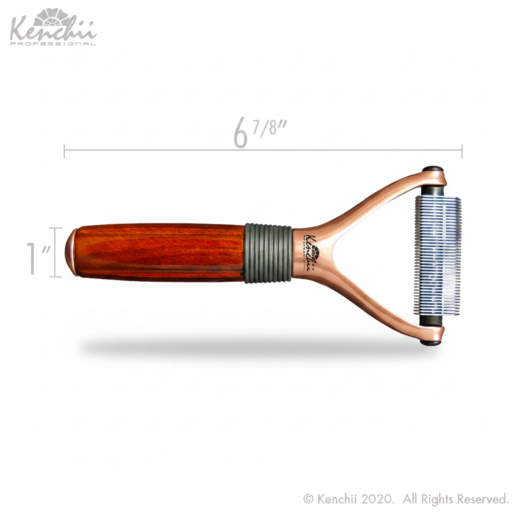 A luxury pet rake with a rose gold finish and a wooden handle with a rubber grip. The rake has multiple rounded end blades and is 6 inches long.