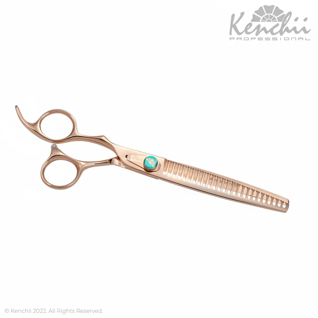 A pair of Kenchii Professional ceramic tile scissors in a rose gold finish, featuring a turquoise accent button on the handle, shown against a plain white background.